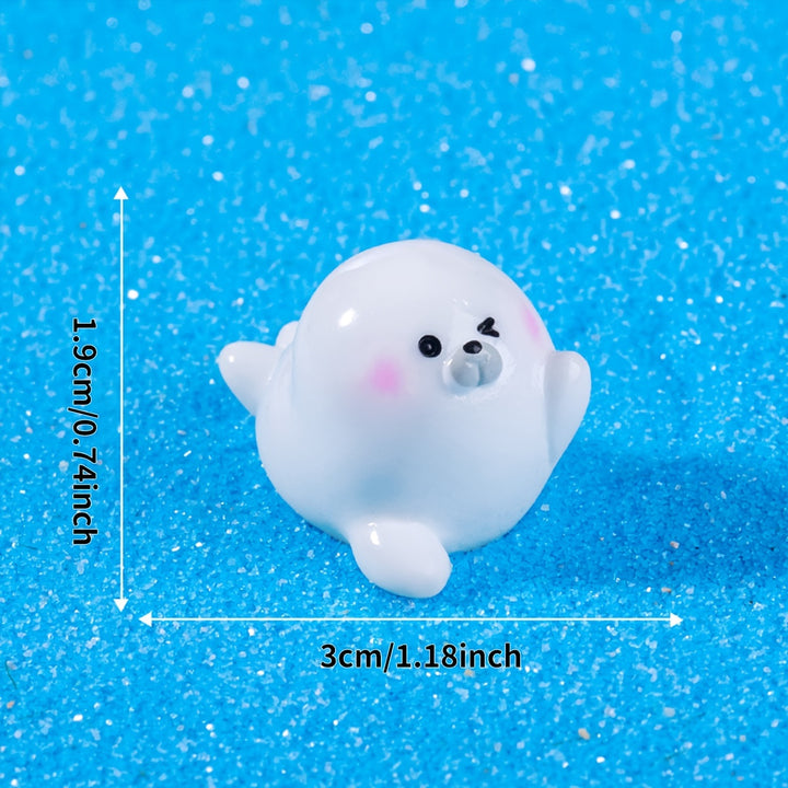 A Set of 4 Cute Creative Seal Ocean Animal Desktop Decorations, Featuring Mini Figurines.