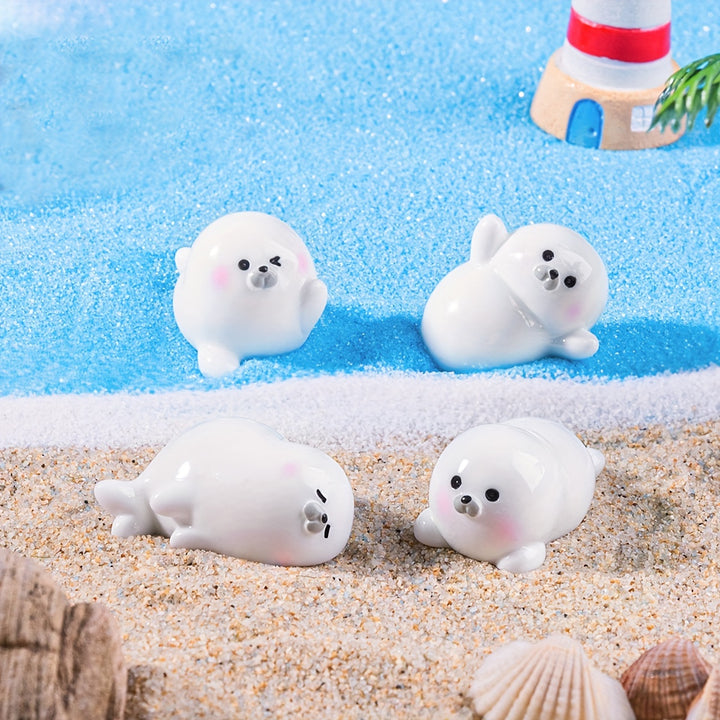 A Set of 4 Cute Creative Seal Ocean Animal Desktop Decorations, Featuring Mini Figurines.