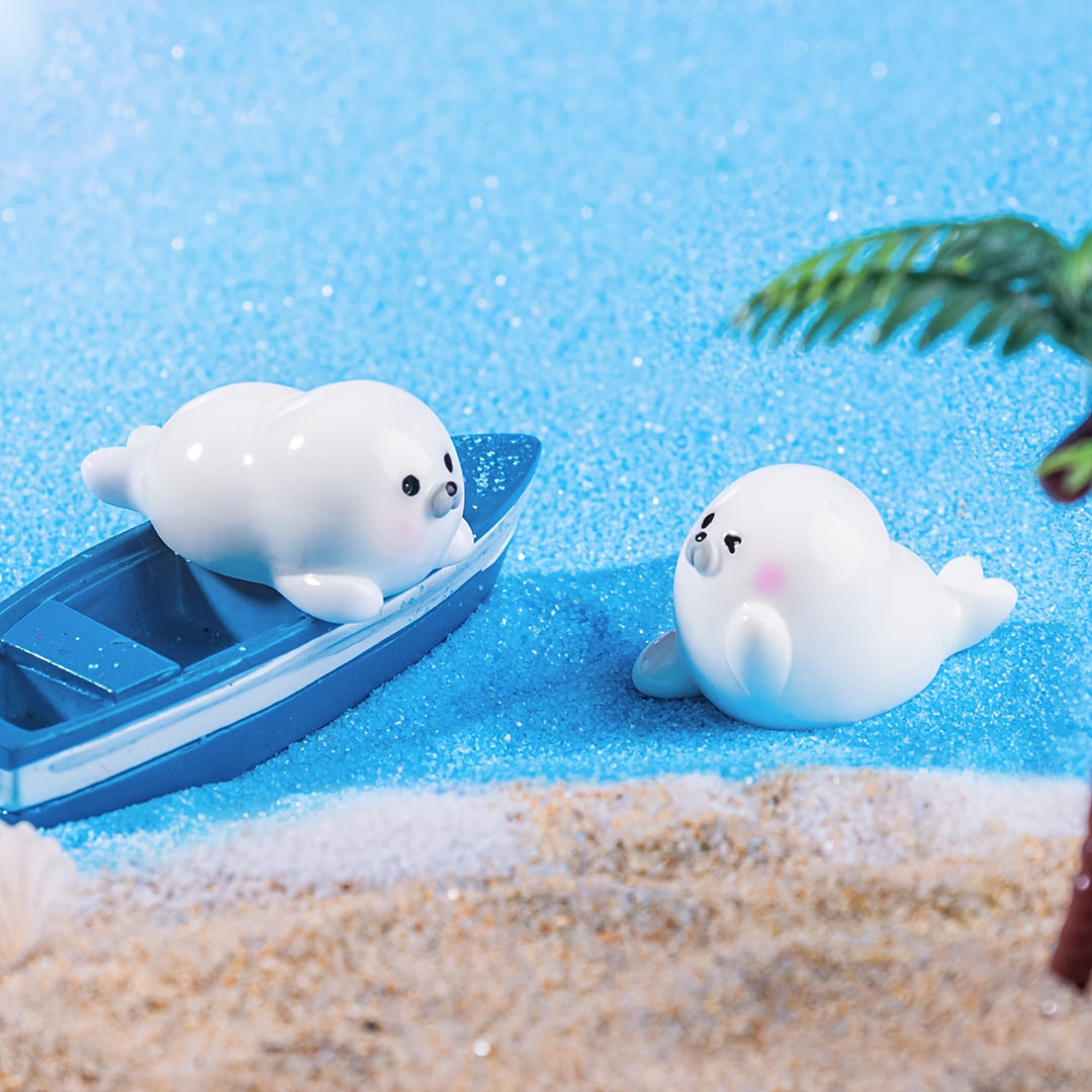 A Set of 4 Cute Creative Seal Ocean Animal Desktop Decorations, Featuring Mini Figurines.