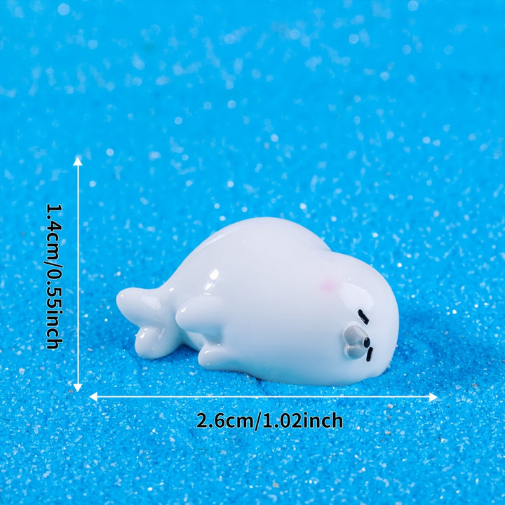 A Set of 4 Cute Creative Seal Ocean Animal Desktop Decorations, Featuring Mini Figurines.