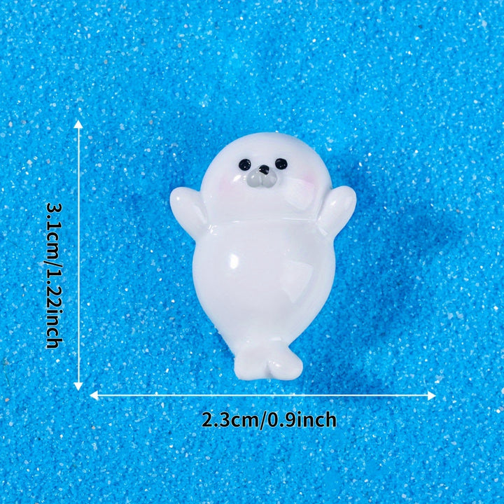 A Set of 4 Cute Creative Seal Ocean Animal Desktop Decorations, Featuring Mini Figurines.